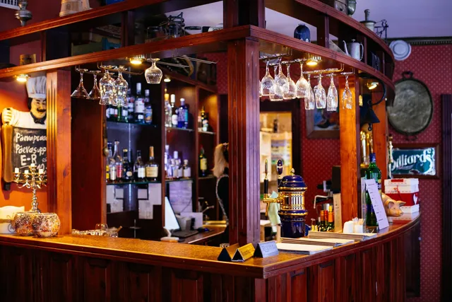 Warm pub interior with a wooden bar using a QR drink menu