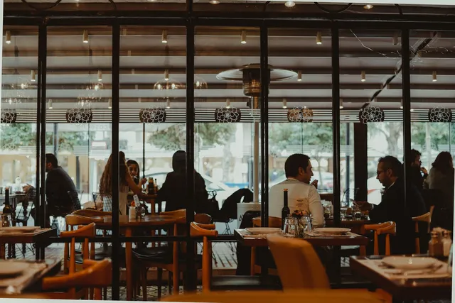 Restaurant dining room with guests browsing a QR code menu